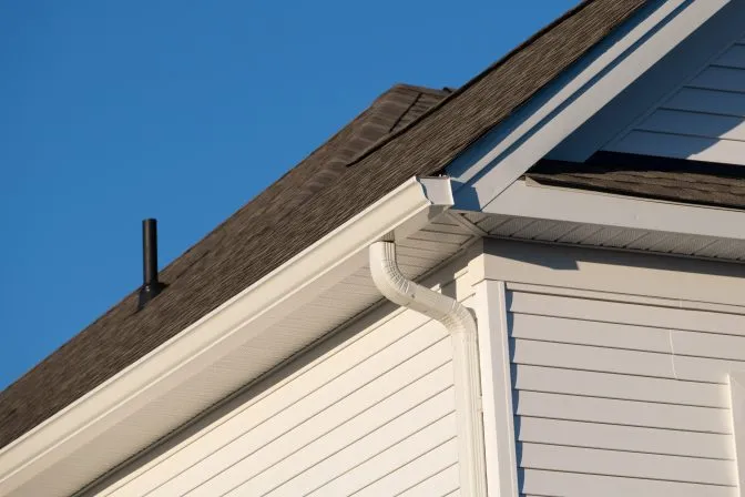 close up to newly installed gutter and downspout by professional gutter installation service