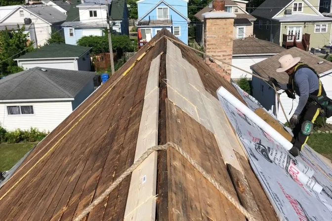 roofing contractor climbing on the roof ready for shingle roof installation