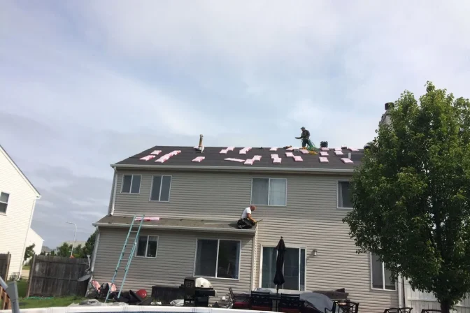 roofing contractor team working on the roof installation