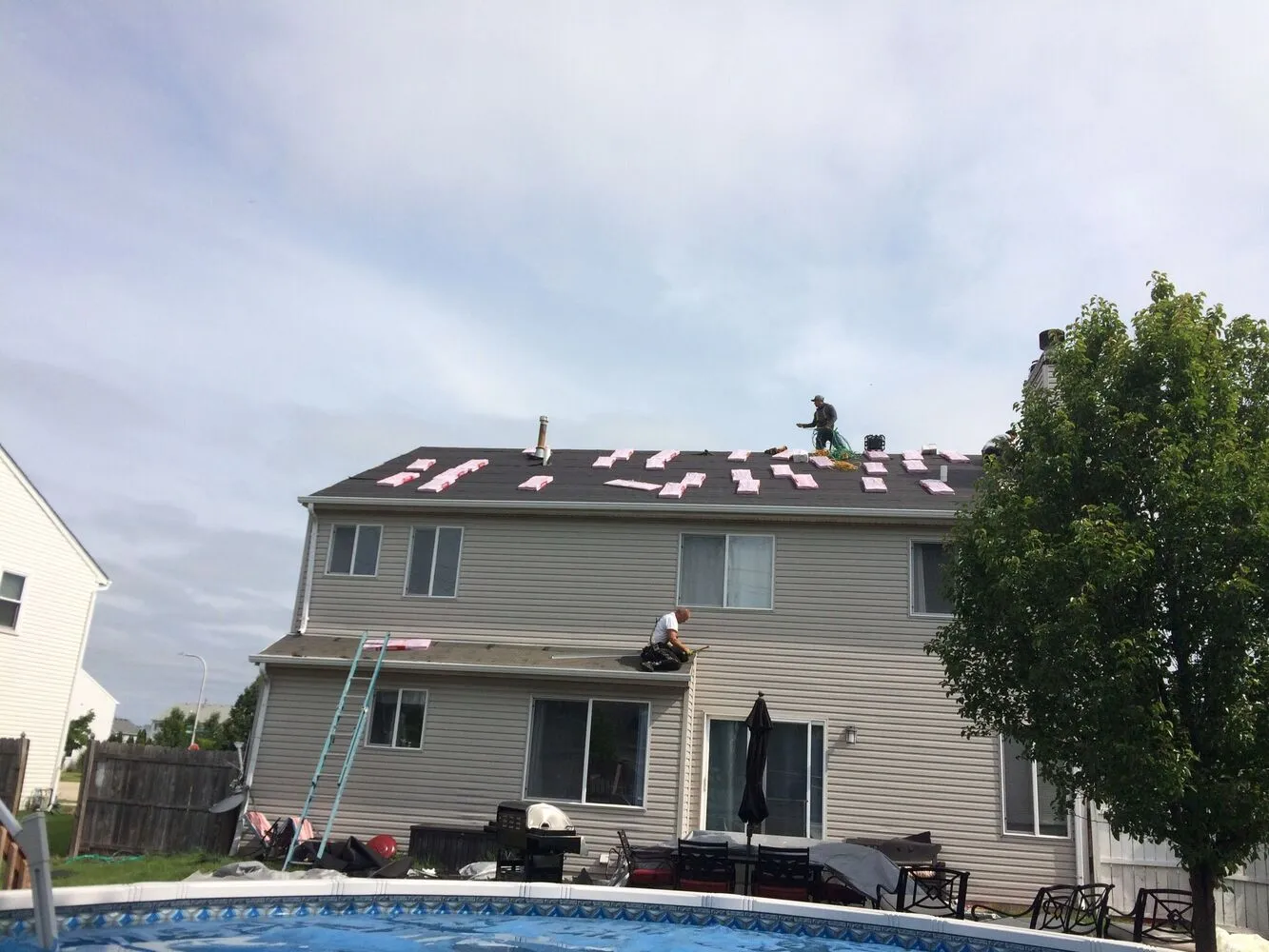 roofing contractor team working on the roof installation