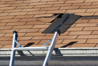 Preparing to repair broken shingle roofing Chicago
